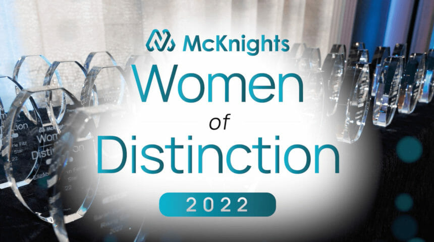 McKnight's Women of Distinction logo in from of table of awards