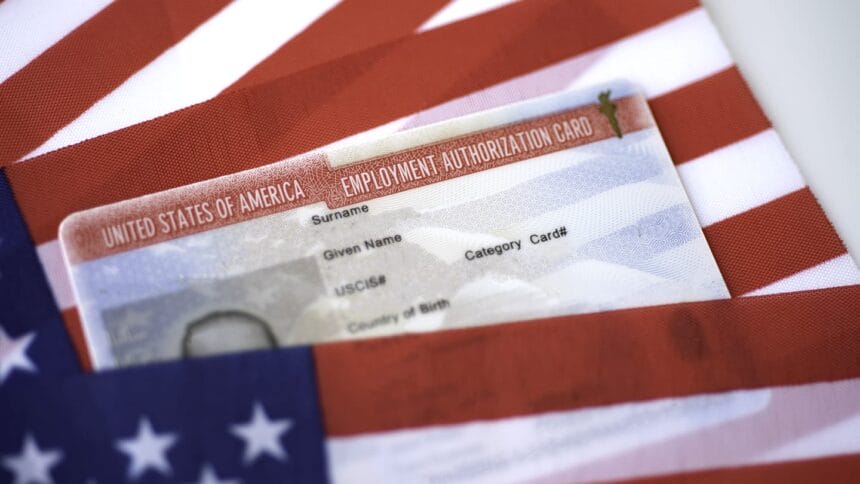 Employment Authorization card on USA Flag surface. Close up view.